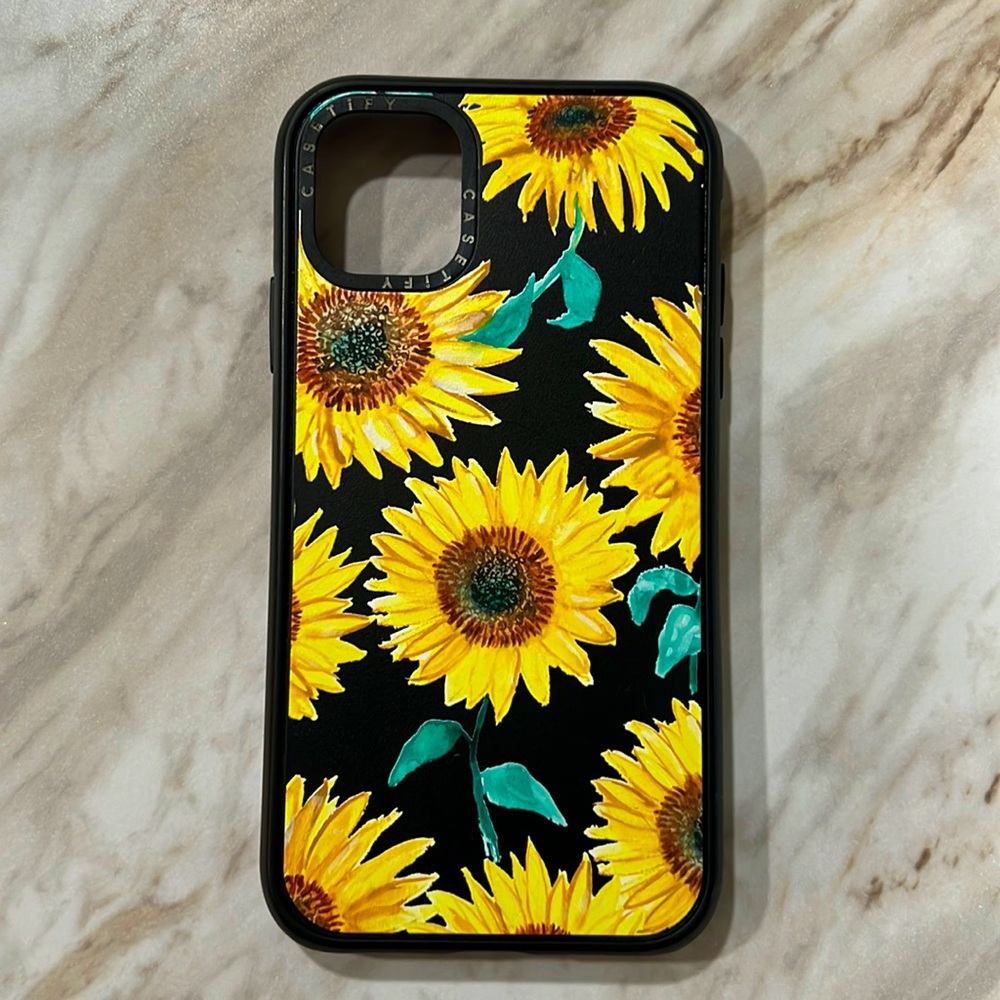 Casetify iPhone 11 Impact case - sunflowers with solid black background.